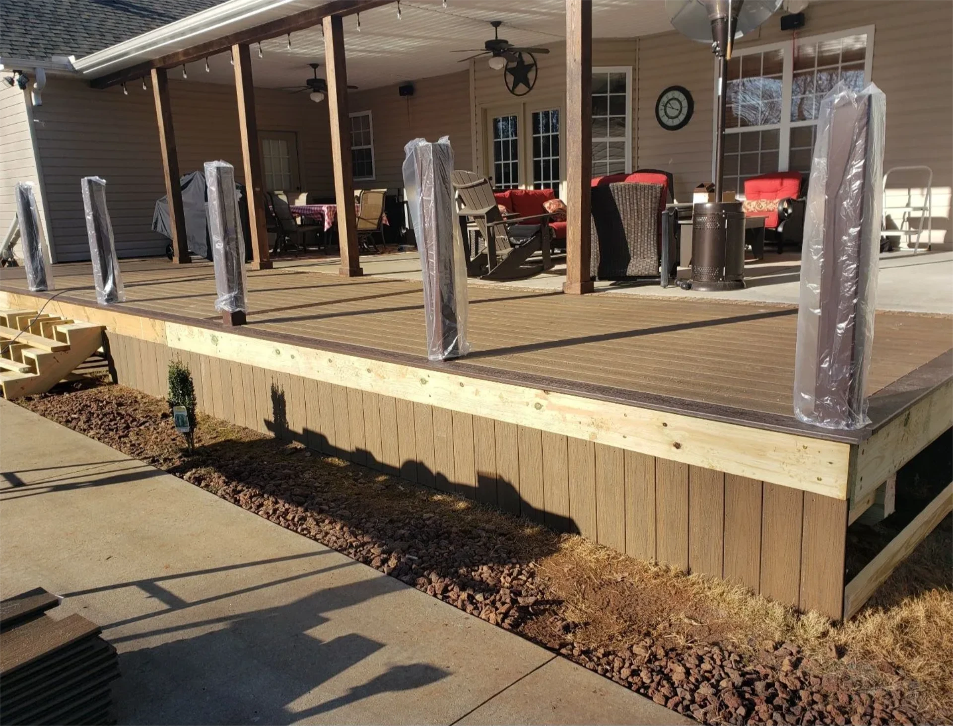 Covered backyard deck with wrapped posts