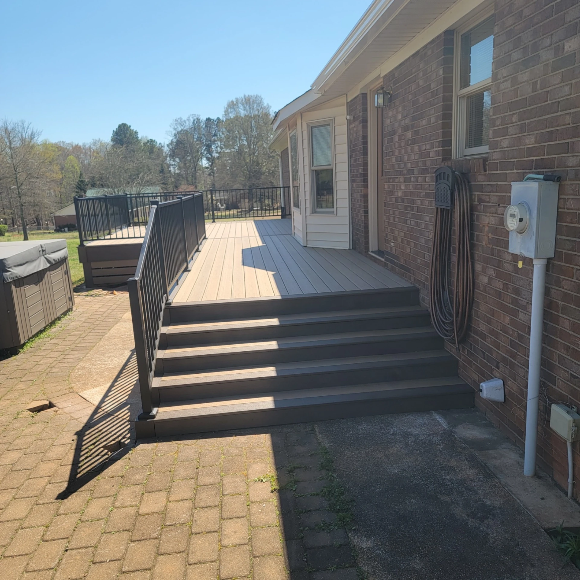 Side view of deck stairs and railing