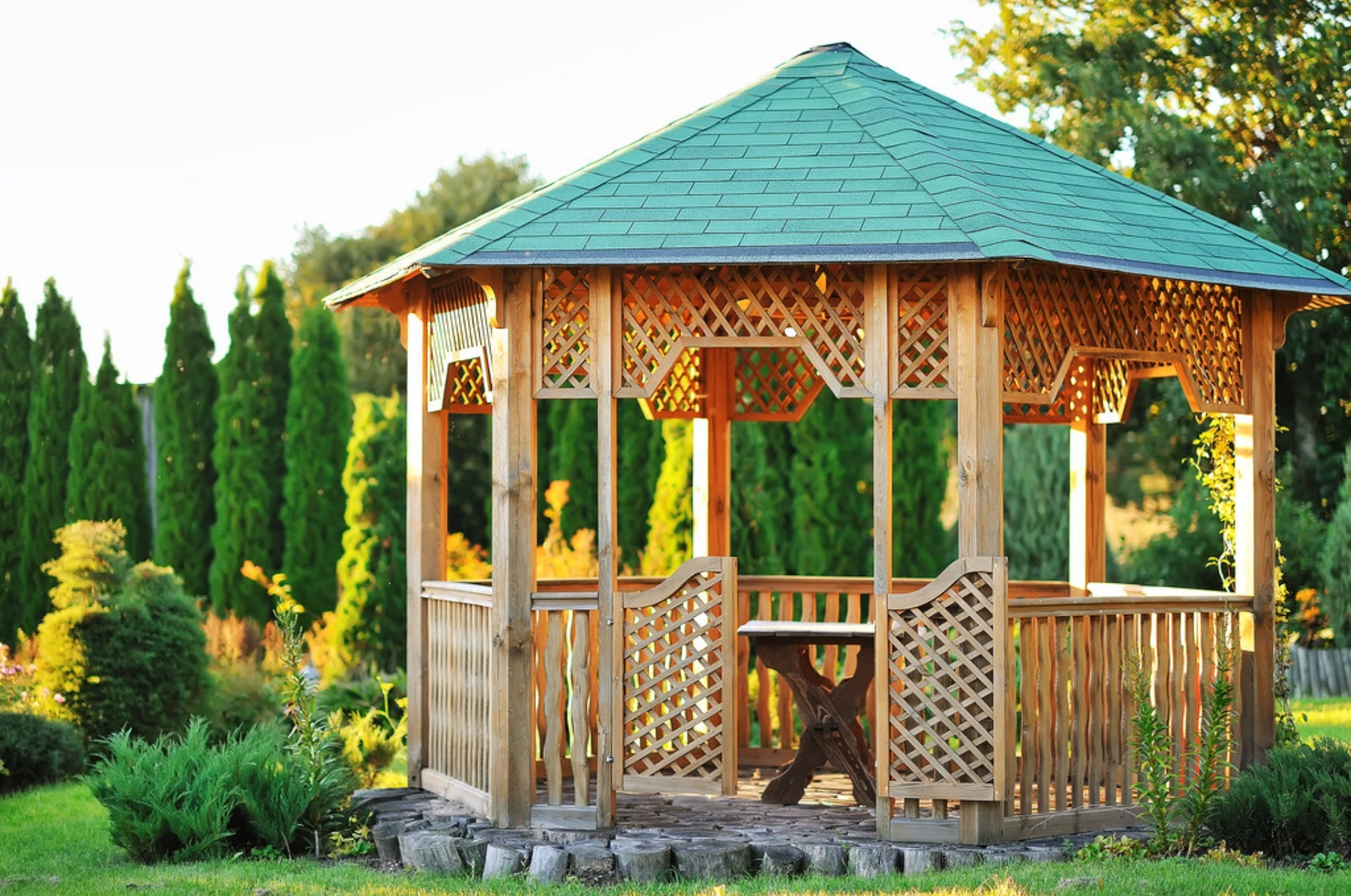 Bright outdoor wooden gazebo over summer landscape background