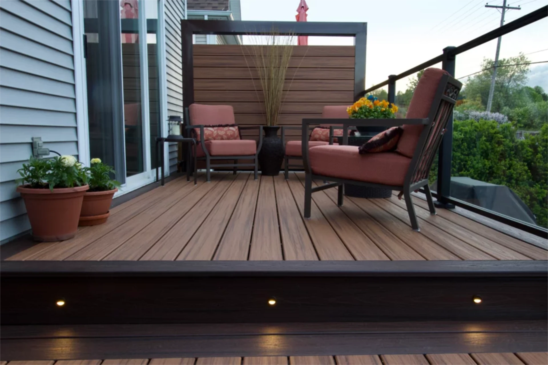 Brown wooden deck glass railing privacy wall