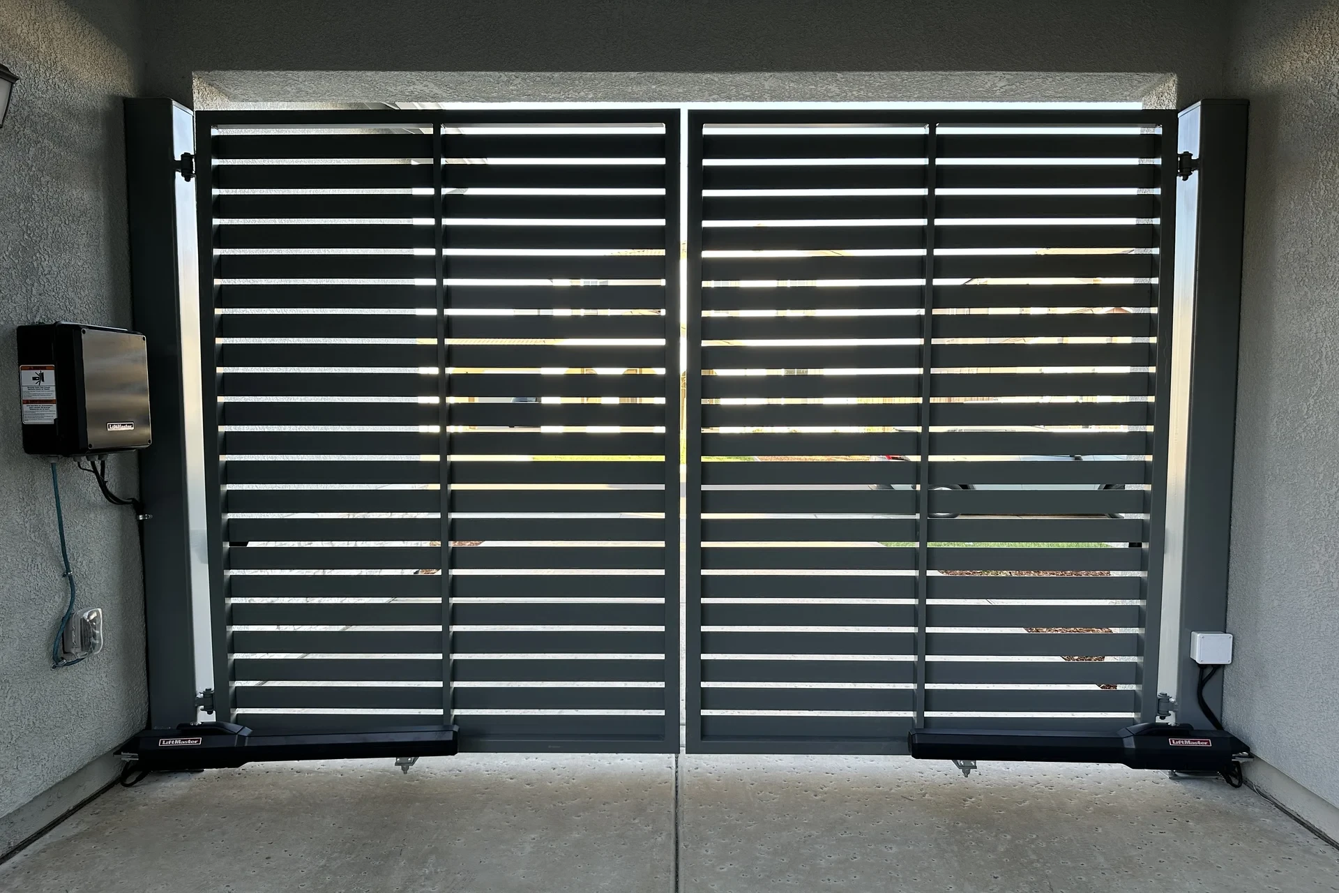 Front view stock black metal gate inside building