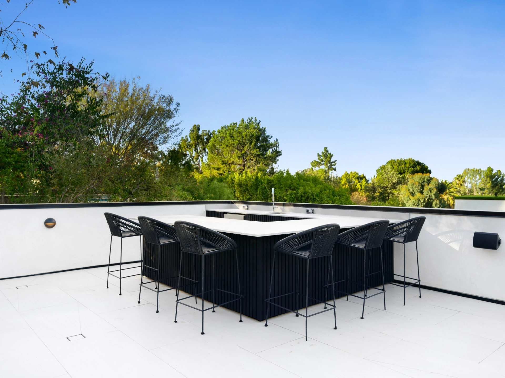 Table placed alongside a building facade and a beautiful scenery