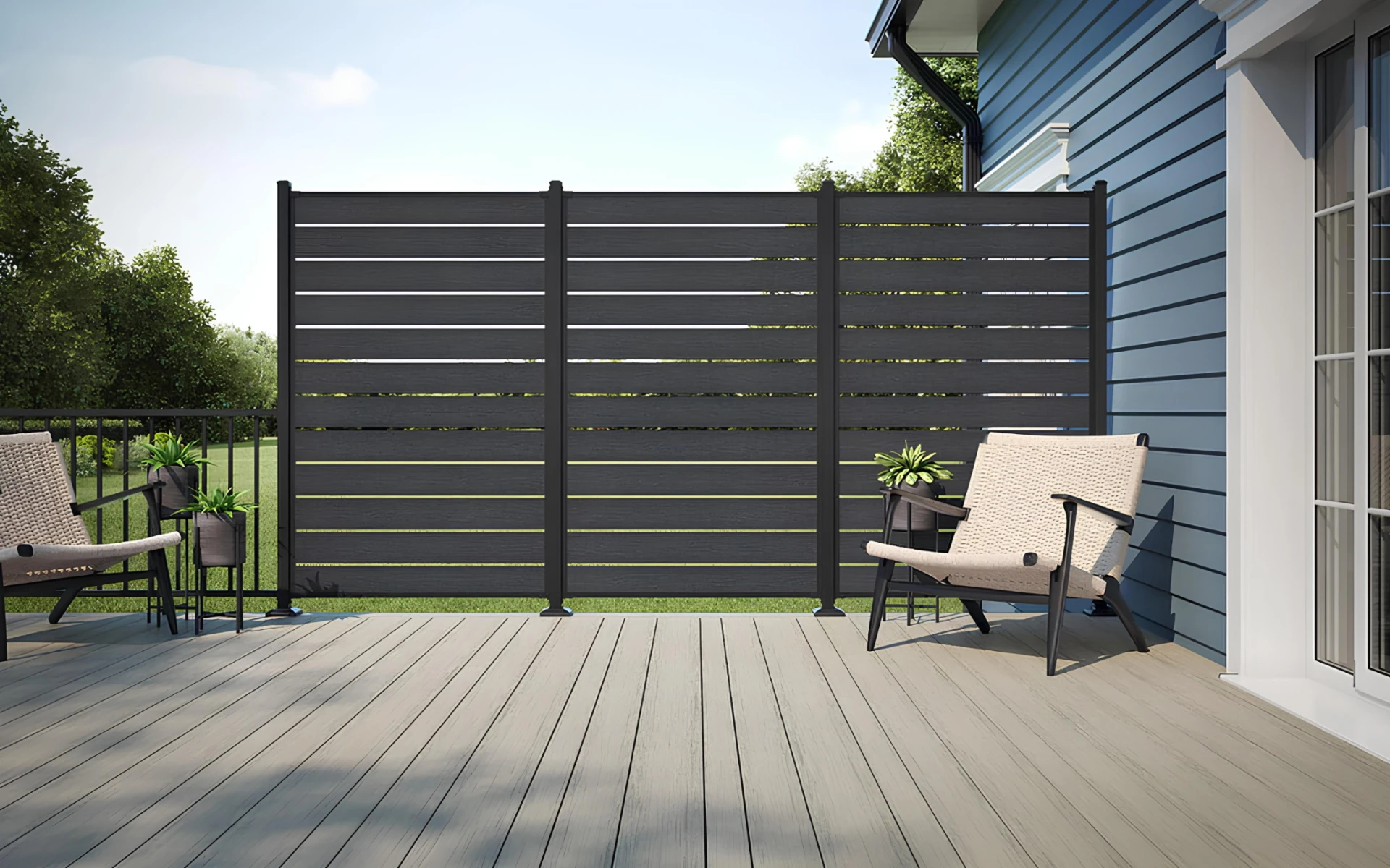 Voyage tundra varied width dark slate privacy screen in a gray deck